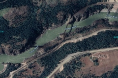 Google satellite view of Cisco bridges. The river is flowing right to left (north to south.) CN tracks eastward are from lower left to upper right. CP tracks traverse the middle of the image. At lower left is the CN Cisco facility. The connecting track leaves CN  at the midpoint going downgrade to join CP at the extreme right.